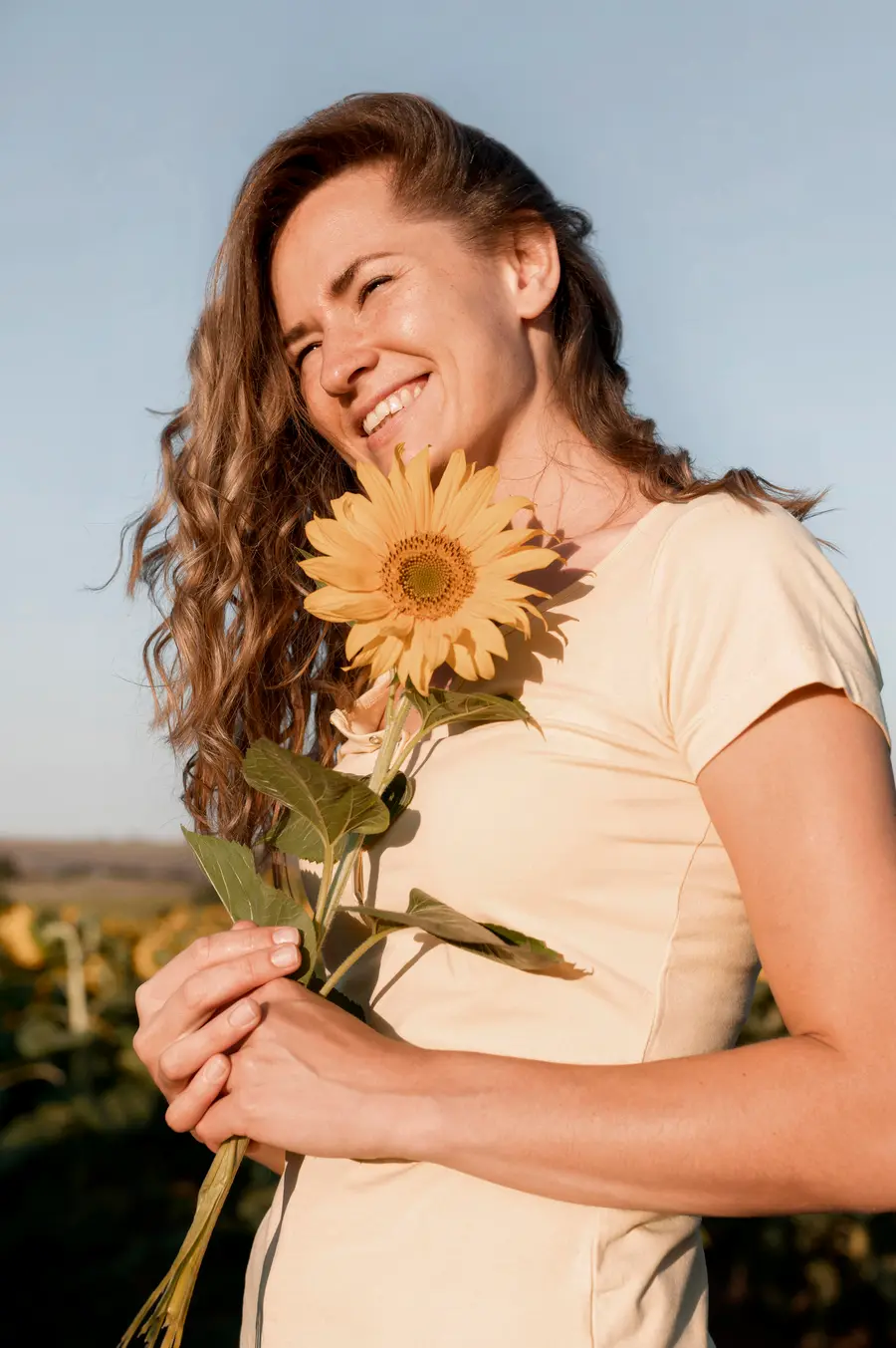 Woman smiling with flowers